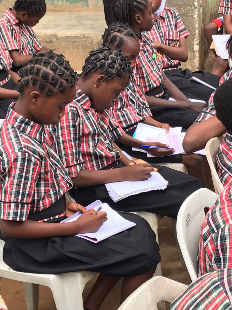 Students taking notes during a STEM IN YOU activity