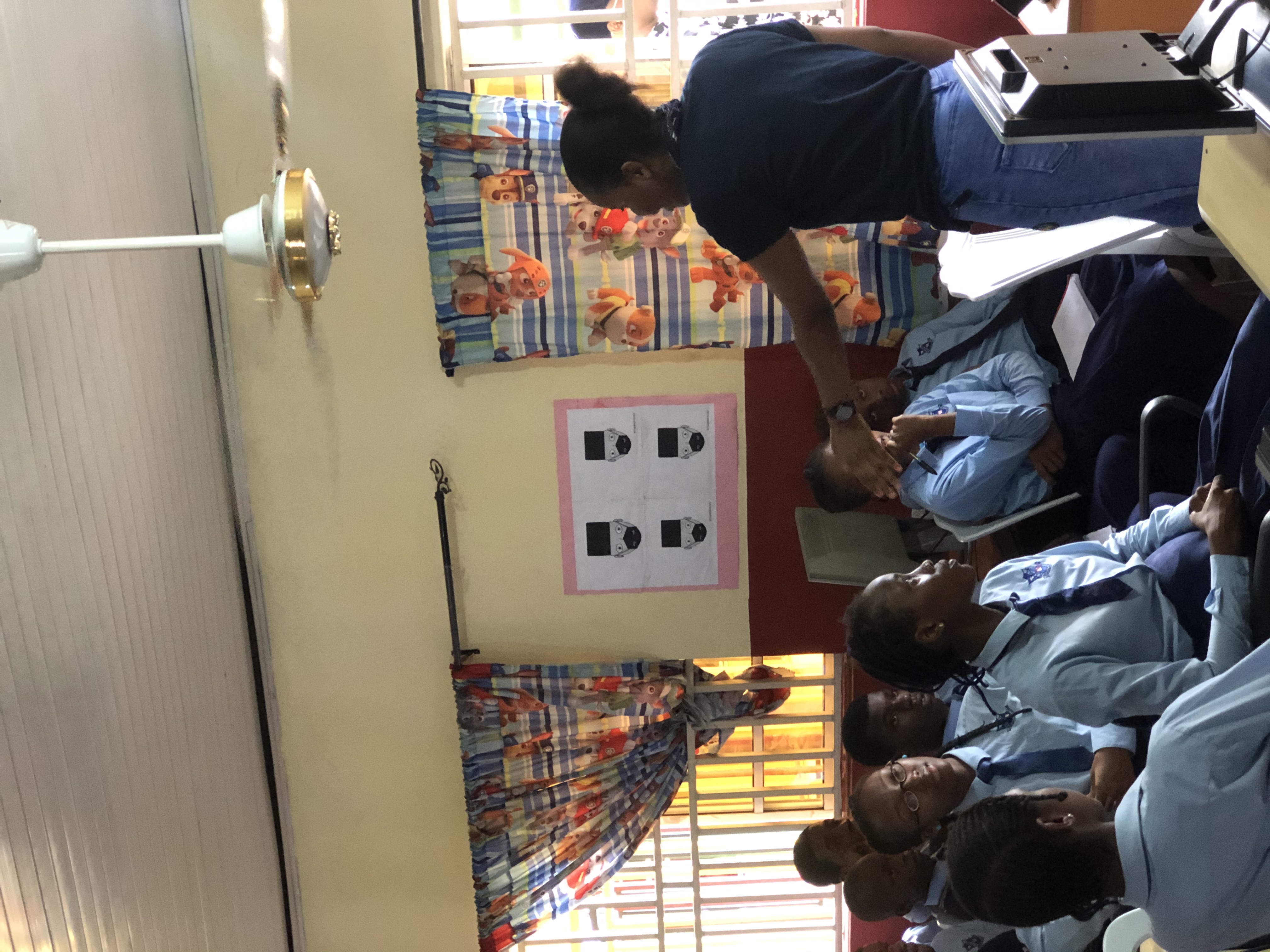 Facilitator engaging students during a STEM presentation